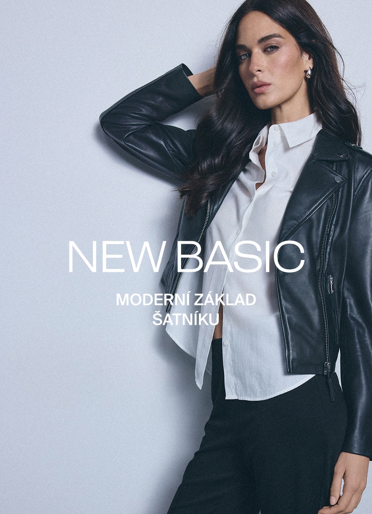 Dámský outfit s koženou bundou a bílou košilí představující moderní základ šatníku pro elegantní každodenní styl